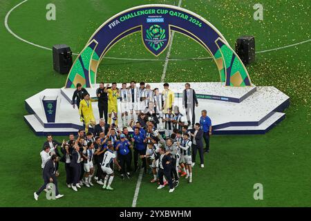 14th December 2024: Doh, Qatar: Players of C.F. Pachuca celebrate their victory with the trophy following the penalty shootout during the FIFA Challenger Cup and FIFA Intercontinental Cup football match between Mexico's Pachuca and Egypt's Al-Ahly, at 974 Stadium, in Doha, Qatar Stock Photo