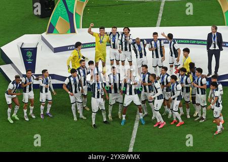 14th December 2024: Doh, Qatar:  Players of C.F. Pachuca celebrate their victory with the trophy following the penalty shootout during the FIFA Challenger Cup and FIFA Intercontinental Cup football match between Mexico's Pachuca and Egypt's Al-Ahly, at 974 Stadium, in Doha, Qatar Stock Photo