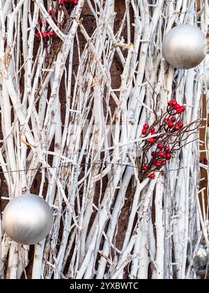 outdoor New Year decor - silver balls on silver colored tree branches closeup in Yerevan city Stock Photo