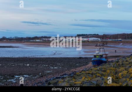 The small Fishing Boat Our2Boys washed up after Engine failure into the sea defences of ArbroathÕs West Links in NE Scotland. Stock Photo