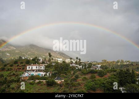 Rainbow over hills of Andalusian Countryside, Mijas, Costa del Sol, Spain. Stock Photo