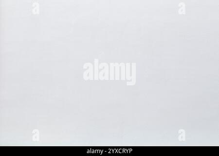 Front view of a clean, blank and new plastered wall painted in white on sunny day. Abstract high resolution full frame textured background, copy space Stock Photo