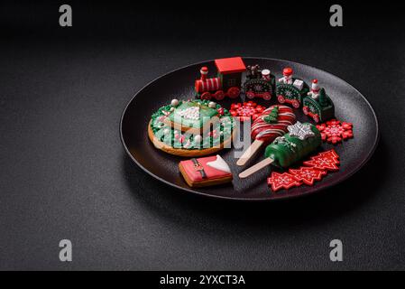 Natural popsicle ice cream on a stick covered with chocolate in the style and colors of Christmas and New Year on a dark concrete background Stock Photo