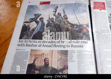 'Joy in Syria as decades of brutal rule end with Bashar al-Assad fleeing to Russia' newspaper headline Syria Assad downfall article 9 December 2024 UK Stock Photo