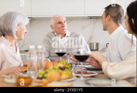Happy senior man celebrating birthday with family Stock Photo