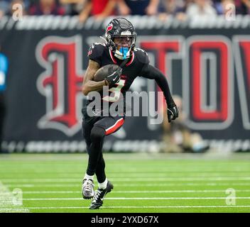 Houston, Texas, USA. 15th Dec, 2024. Texans wide receiver Tank Dell (3) carries the ball during the first half of an NFL game between the Texans and the Dolphins on December 15, 2024 in Houston, Texas. The Texans won, 20-12. Credit: ZUMA Press, Inc./Alamy Live News Stock Photo