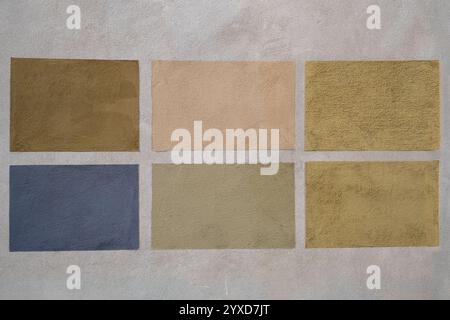 Samples for testing colours on gray plaster of a wall of a historic building Stock Photo
