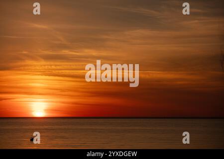 Sunset (or sundown) with a boat at Marco Island, Gulf of Mexico, Florida Stock Photo
