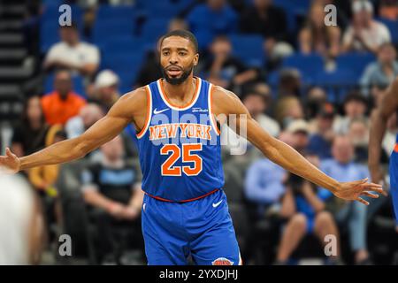 New York Knicks guard Mikal Bridges is helped up during the first half ...