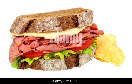 Pastrami and salad sandwich in sliced German style crusty sourdough rye bread with mayonnaise isolated on a white, background Stock Photo