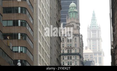 New York City Lower Manhattan Downtown Financial District, United States. Woolworth building high-rise skyscraper, Broadway street perspective, USA. American urban architecture. Gothic tower in NYC. Stock Photo