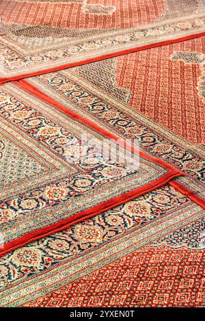 Wonderful view of traditional Iranian carpets in prayer hall Stock Photo
