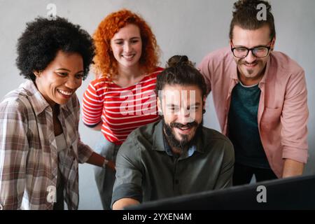 Group of business people and software developers working as a team in office Stock Photo