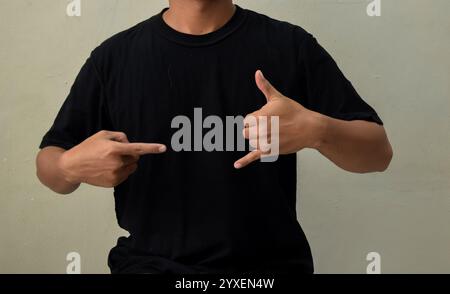 Young man showing CALL ME gesture in sign language Stock Photo