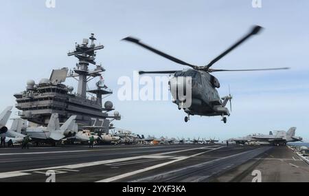 Helicopter Merlin mk2. landing in aircraft carrier USS George W. H. Bush Stock Photo