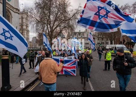 London, UK. 14th December, 2024. Activists from pro-Israel group Our Fight march to Parliament Square to hold a counter-protest to the Rally for Palestine. Credit: Mark Kerrison/Alamy Live News Stock Photo