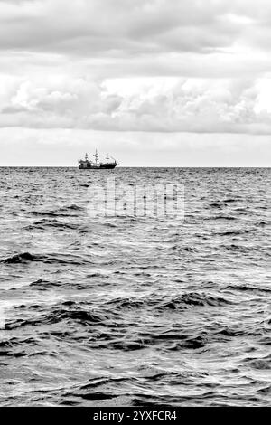 Fishing boat at dramatic sunset on Black Sea coast, Batumi, Georgia Stock Photo