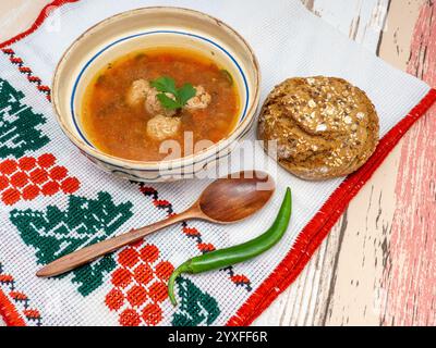 romanian dish ciorba de perisoare or meat ball soup Stock Photo