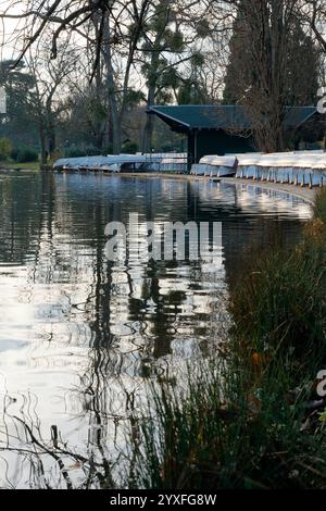 Reflective waters and serene pathways in Bois de Vincennes during a quiet afternoon in Paris Stock Photo