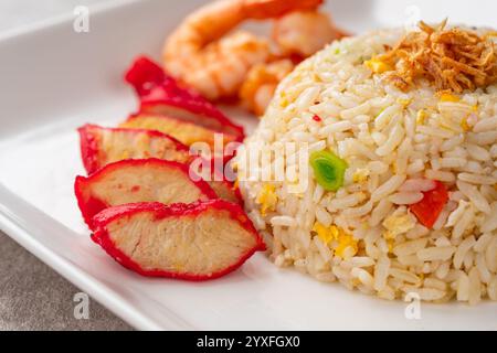 Yangzhou fried rice is a popular Chinese-style wok fried rice dish. Asia Chinese China food cuisine. Authentic Yangzhou fried rice with egg, fresh pra Stock Photo