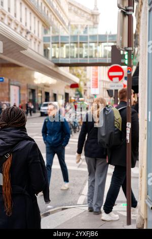 A busy urban street with pedestrians and cyclists Stock Photo - Alamy
