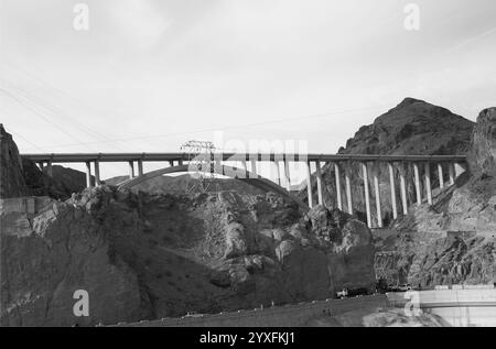 A newly constructed bridge spans a steep cliff above the Colorado River at Hoover Dam, located on the border between Nevada and Arizona, USA. Stock Photo