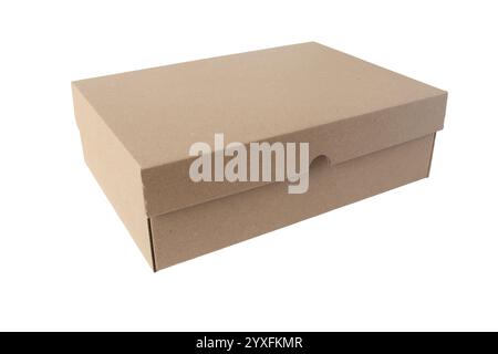 Brown craft paper box isolated on white. Carton rectangular packaging container with lid. Corrugated cardboard closed shoe box. Stock Photo