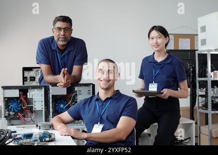Team of IT Technicians Collaborating in Office Stock Photo