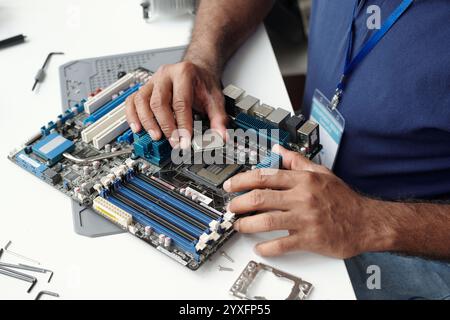 Installing Components on Computer Motherboard Stock Photo