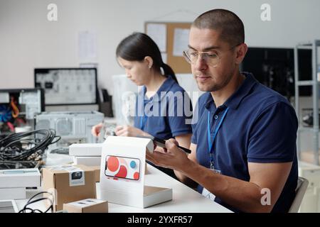 Collaborating on Technology Projects in Office Setting Stock Photo