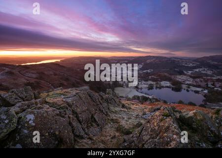 Sunrise over Loughrigg Tarn on a frosty morning, Lake District, UK. Stock Photo