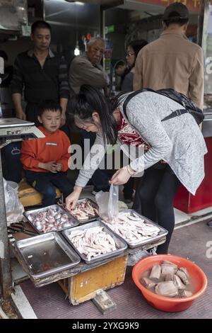 Stall selling duck giblets, including dried duck blood, an inexpensive foodstuff that is very important as a base for many soups, 378 Lane Market, Nan Stock Photo