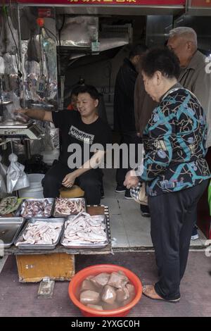 Stall selling duck giblets, including dried duck blood, an inexpensive foodstuff that is very important as a base for many soups, 378 Lane Market, Nan Stock Photo