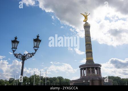 Victory Column next to a beautiful, old street lamp in a blue sky with ...