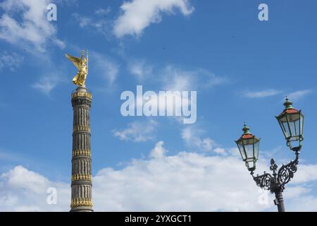 Victory Column next to a beautiful, old street lamp in a blue sky with ...