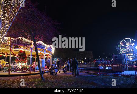 Graz, Austria - November 22, 2019: Vintage carousel and beautiful Christmas decorations at night, in the city center of Graz, Styria region, Austria, Stock Photo