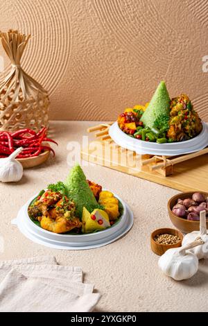 Tumpeng is an Indonesian cone-shaped rice dish with side dishes of ...