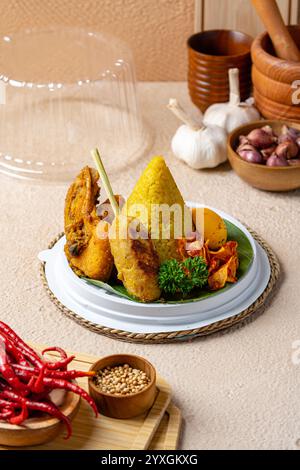 Nasi Tumpeng or Cone Shaped Yellow Rice Traditional Food from Indonesia ...