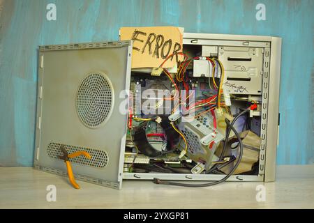 Grungy demolished computer with  ERROR sign,server glitch,offline,disturbance,website down,hacker attack concept Stock Photo