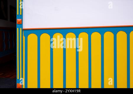 Close-Up Of A Brightly Painted Wall With Yellow And Blue Details In Pijao, Colombia Stock Photo