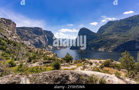 Hetch Hetchy Valley and Resevoir from the Wapama Falls Trail in Yosemite NP with characteristic high granite rocks and unique vegetation. Stock Photo