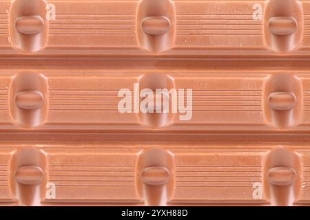 Milk chocolate bar as background. Whole background. Stock Photo
