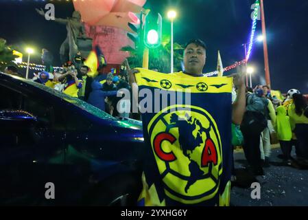 Mexico City, Mexico. 16th Dec, 2024. Hundreds of Club America fans attend at the Coyote Monument in Ciudad Nezahualcóyotl, to celebrating after Club America won the first three-time champion in short tournaments and the 16th in its history. on December 15, 2024 in Mexico City, Mexico. (Photo by Carlos Santiago/ Credit: Eyepix Group/Alamy Live News Stock Photo