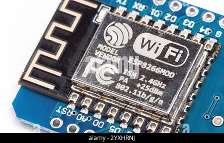 Close-up of Wi-Fi module Espressif Esp8266 controller, logo, electronic component macro detail, IoT wireless communication device, technology detail w Stock Photo