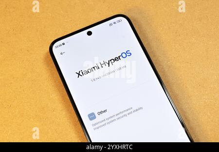 Xiaomi HyperOS system update prompt displayed on smartphone screen, new modern mobile phone operating system OS upgrade, security improvements, perfor Stock Photo