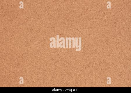 Corkboard texture in warm natural brown tones. Concept of eco-friendly material, neutral background Stock Photo