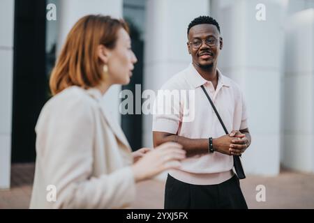Multicultural business team having a casual outdoor meeting Stock Photo