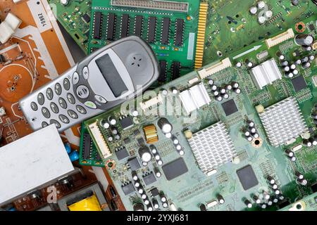 Electronic Waste with Old Mobile Phone and Circuit Boards Stock Photo