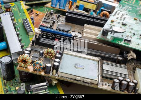 Collection of Discarded Circuit Boards and Computer Components Stock Photo