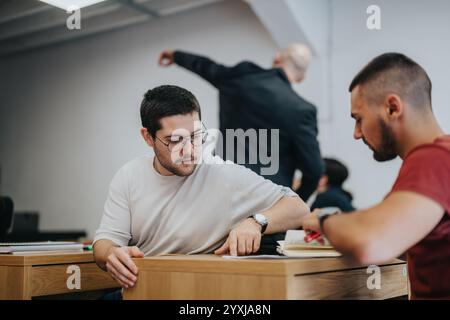 Engaged students collaborating during a classroom learning session Stock Photo